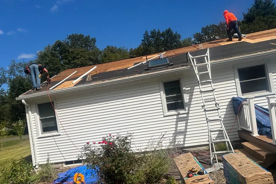 Roofers preparing a residential roof deck