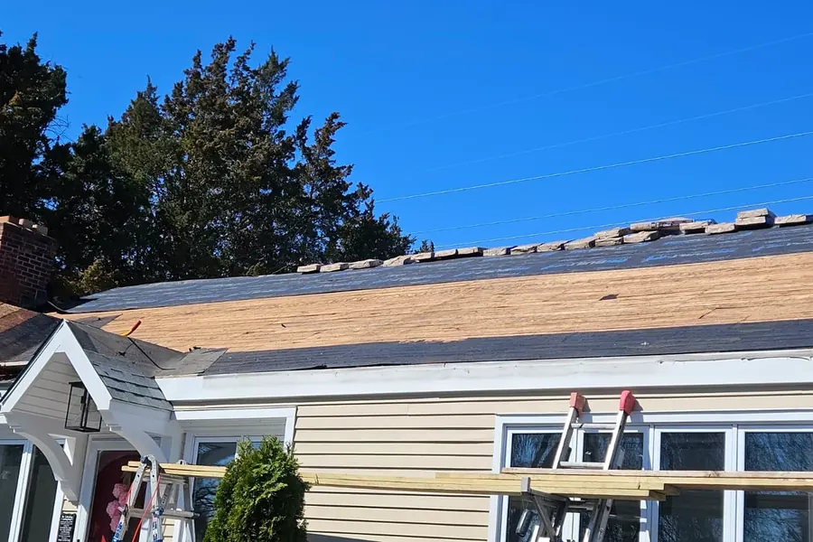 Wood roof decking and underlayment during roof replacement