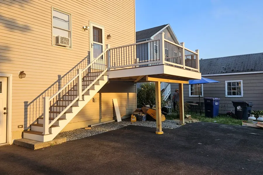 Raised wooden deck and exterior stair construction